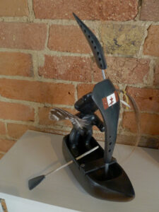 Shaman in Black Boat